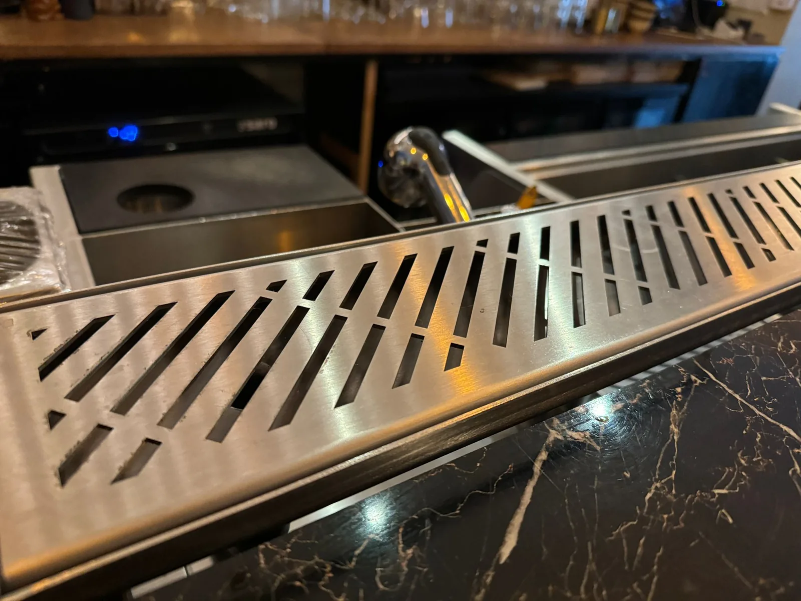 Close up of the drink rail drainage slots