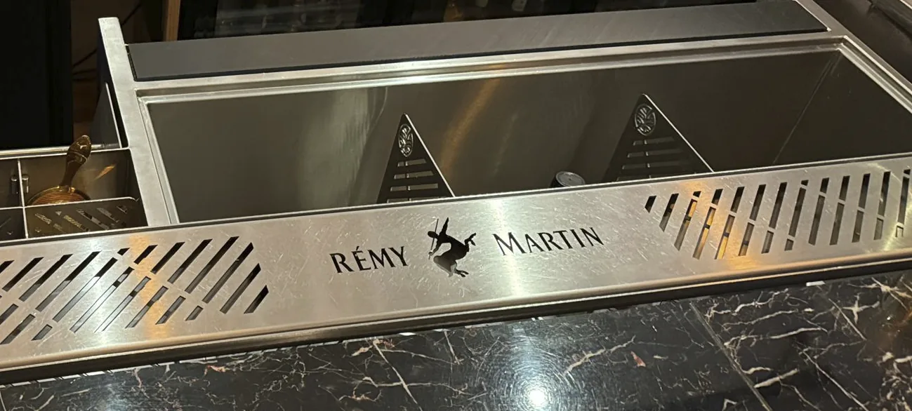 Drink rail with a custom laser-cut logo