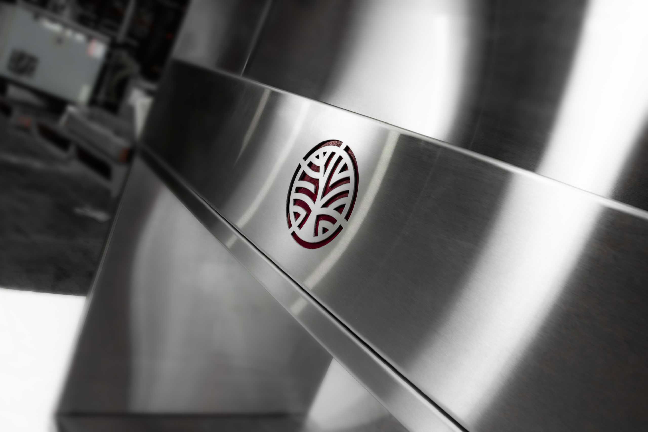 Kobayashi speed rail with engraved logo on bartender station